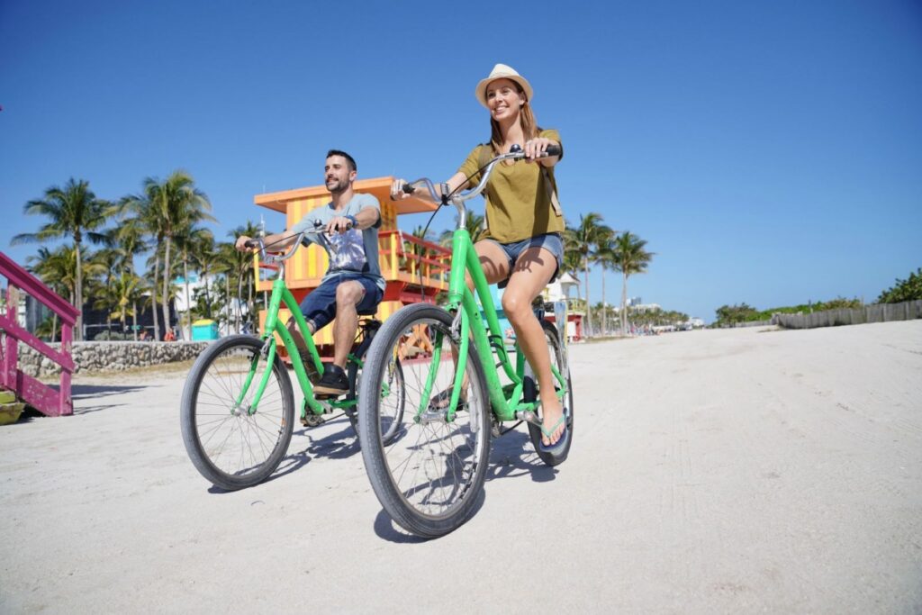 couple riding bikes on anna maria island