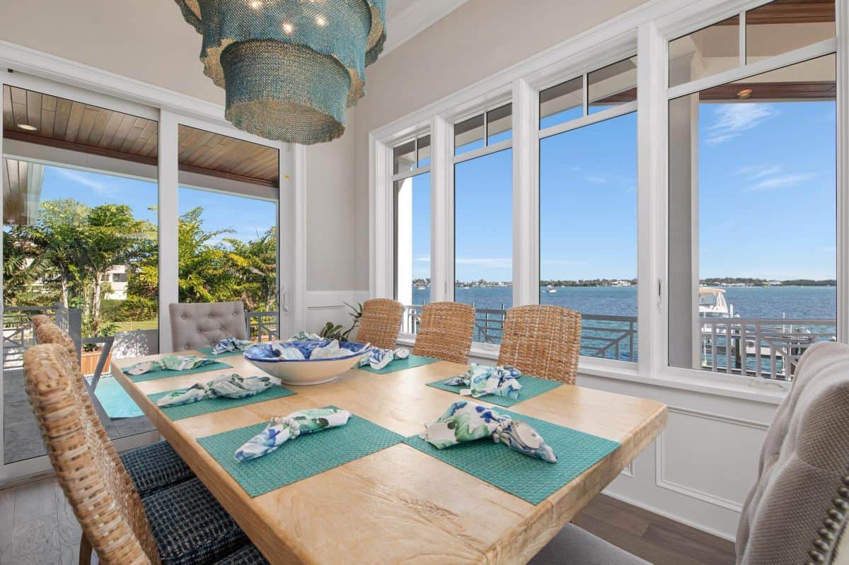 dining area with waterfront view in AMI rental